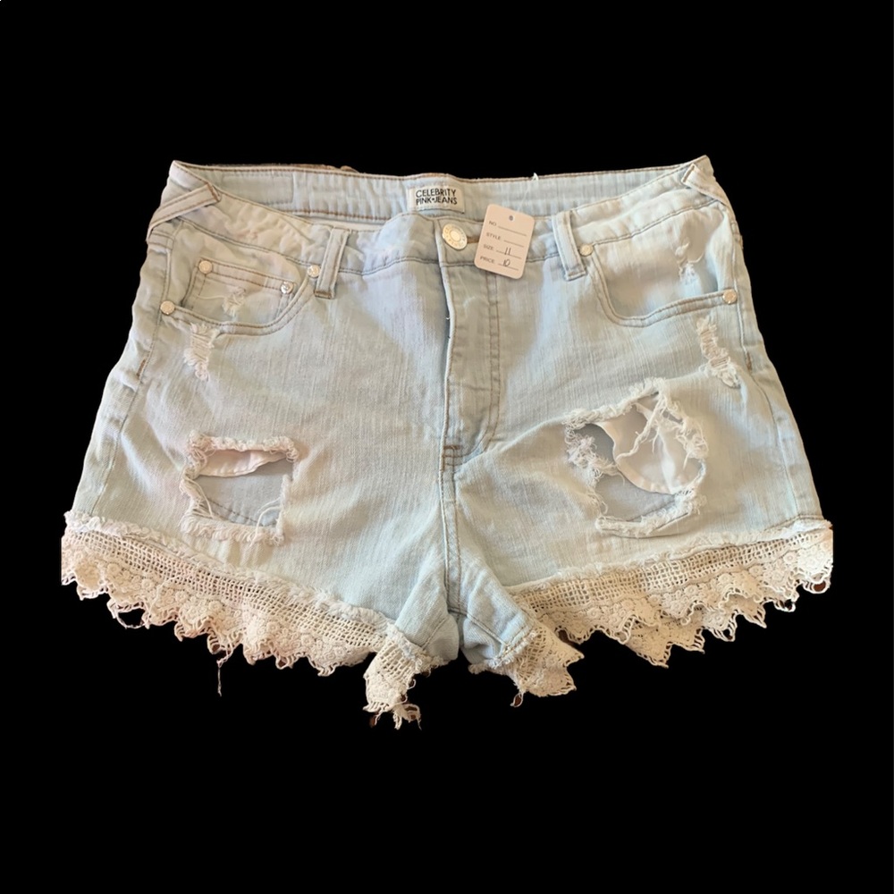 Size 11 light washed leave fringed jean shorts